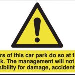 park at own risk signs