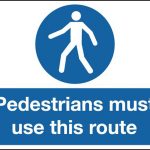 pedestrians must use this route stanchion sign